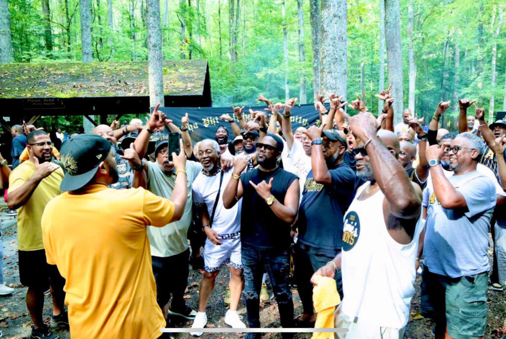 Marketing Chair, Bro. Bobby Manning, throwing it up with the Brothers of ΑΦΑ ΠΥΛ.